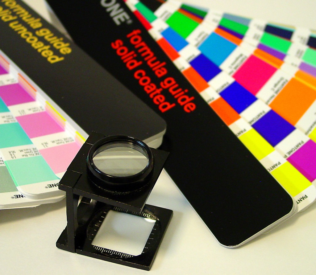 Color swatches in various hues alongside a magnifying glass for viewing details.